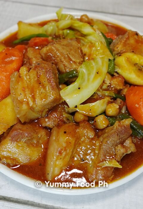 Pork Pochero recipe stew with bananas and chorizo simmering in a pot