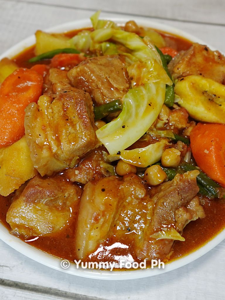 Pork Pochero recipe stew with bananas and chorizo simmering in a pot