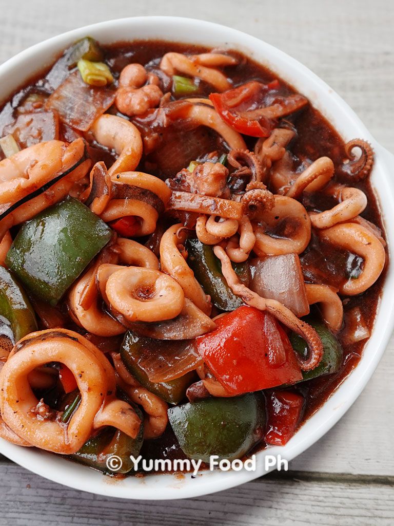 A sizzling tender squid recipe in a rich sauce with bell peppers and chilies.